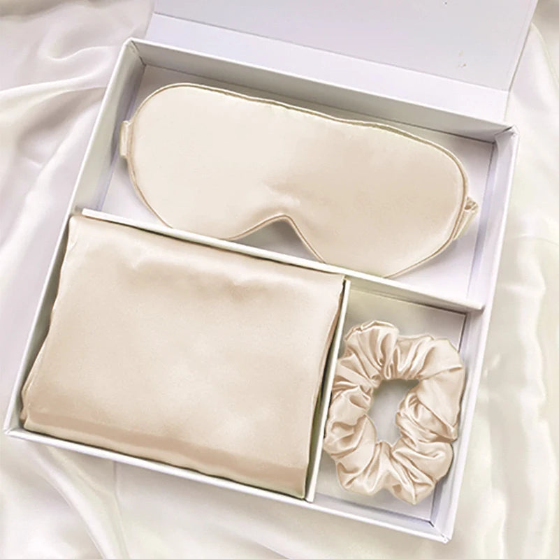 Silk gift set in a compartmented gift box, shown with a pillowcase, eye mask and scrunchie
